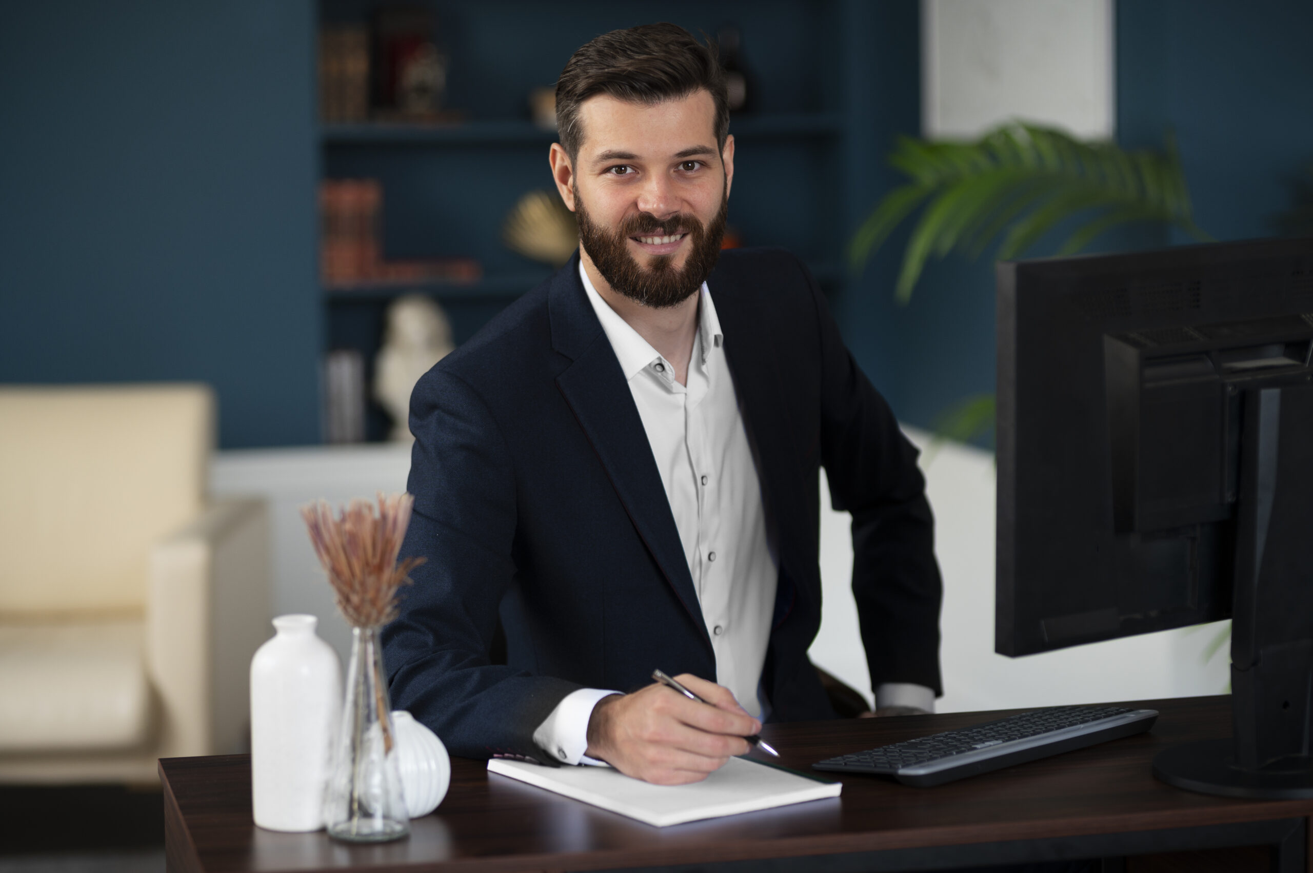 medium shot smiley man sitting desk scaled