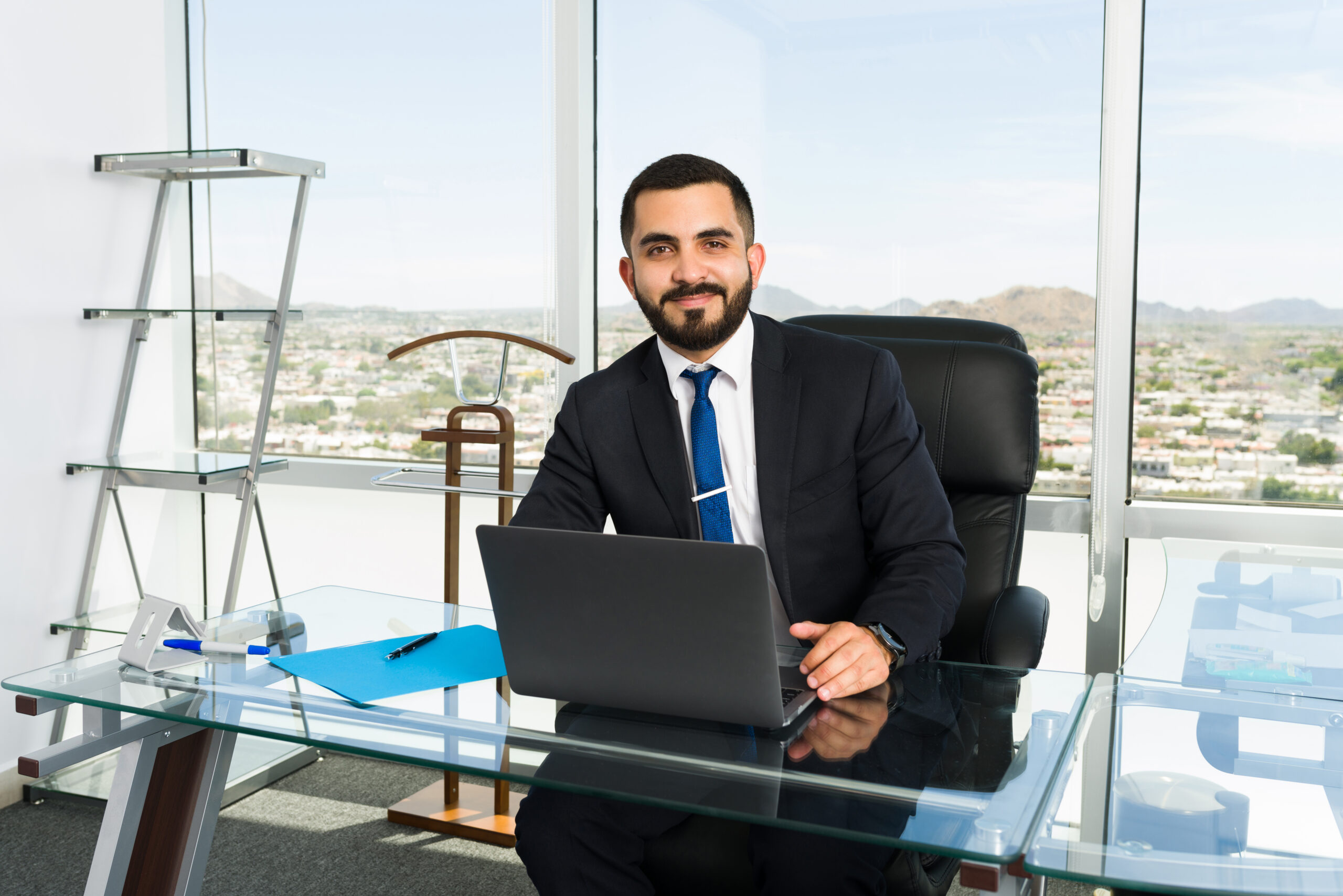 portrait good looking business executive businessman feeling happy doing lucrative job his stylish office with big city view scaled
