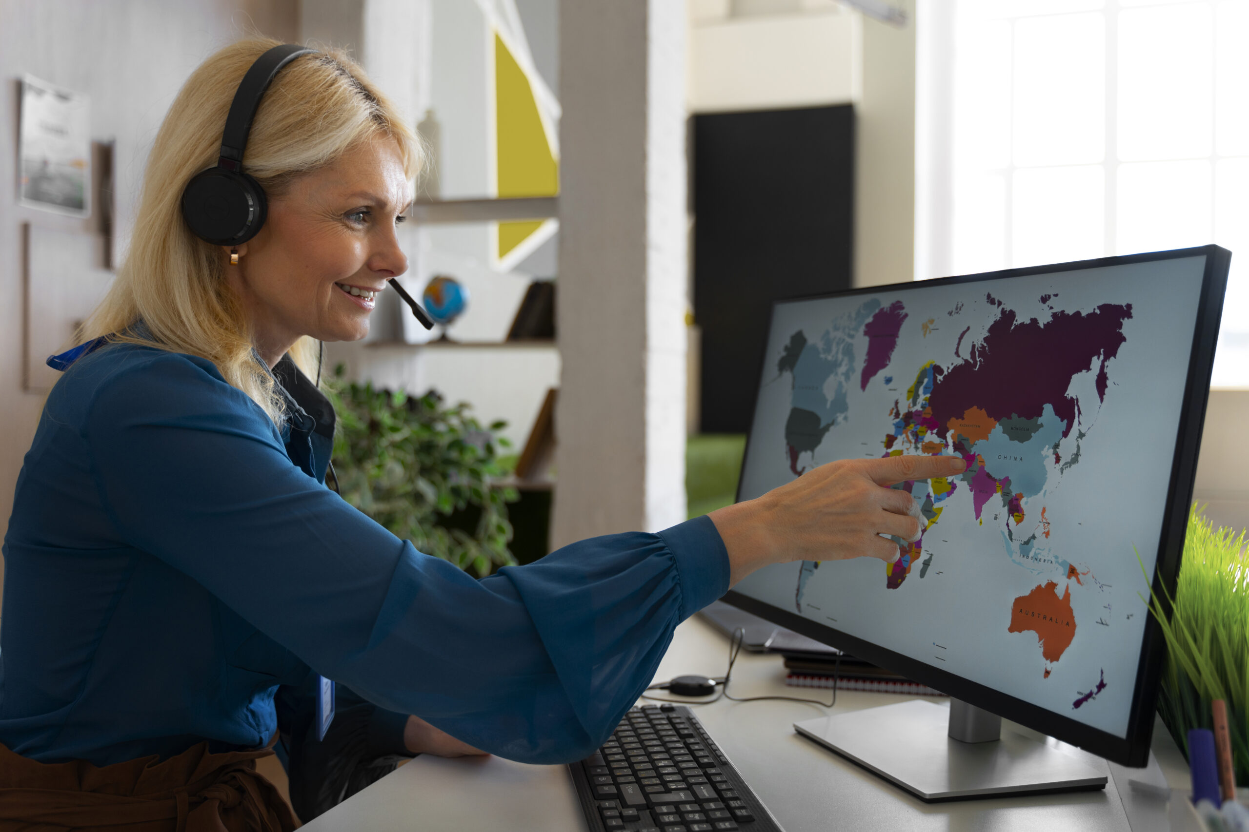 medium shot woman working office travel agency scaled