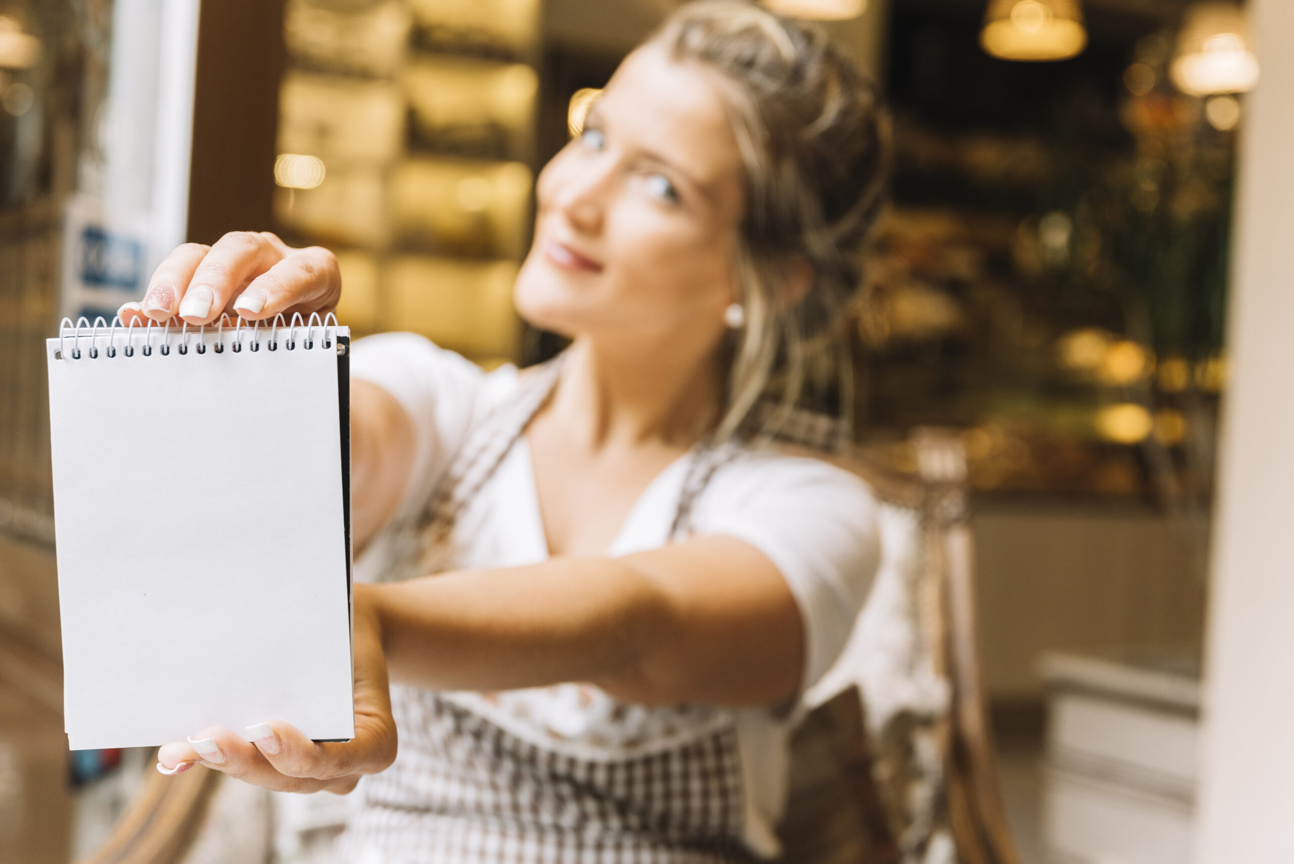 waitress showing notebook scaled